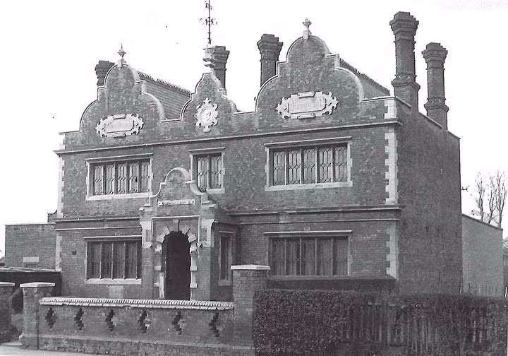Historical black and white photograph of Heston Westbrook Memorial Institute featuring Dutch gables, tall brick chimneys, and leaded windows
